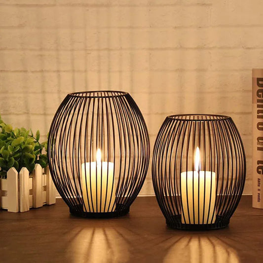 Black iron lantern candle holder, a minimalist rustic decor piece that creates a cozy, warm ambiance with candlelight.