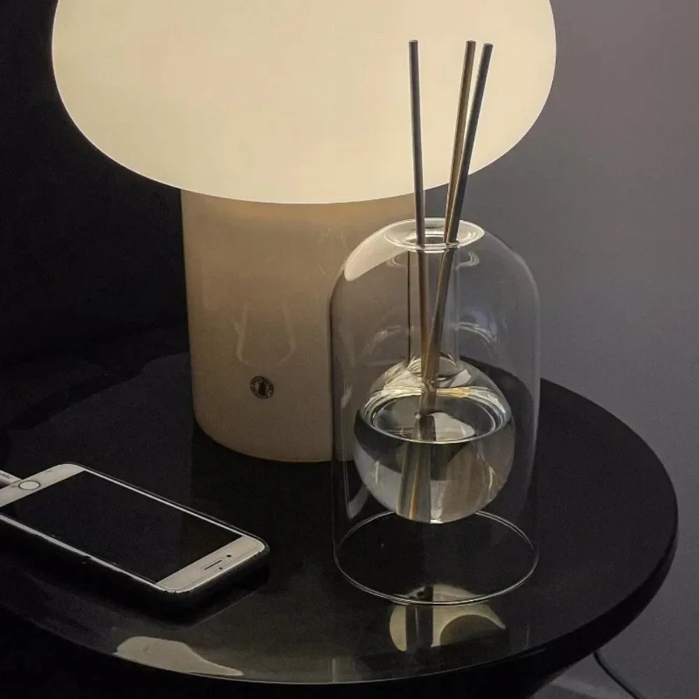 Elegant glass reed diffuser with a simple, clean design, perfect for enhancing the aesthetic of your living room or bedroom.