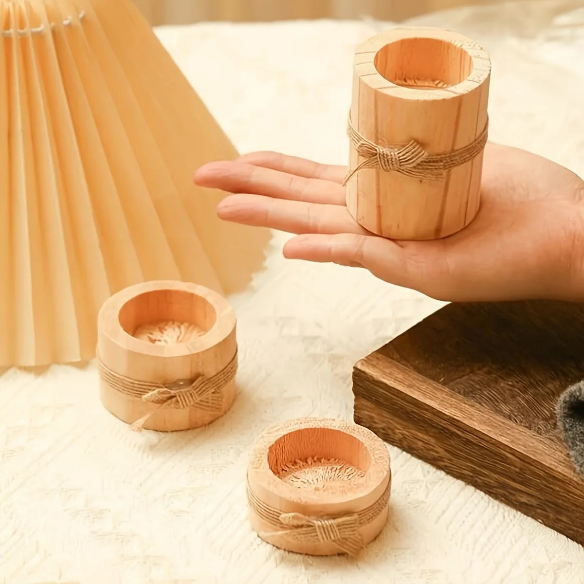 Rustic wooden tealight candle holder set, perfect for farmhouse table decor and creating a warm ambiance.